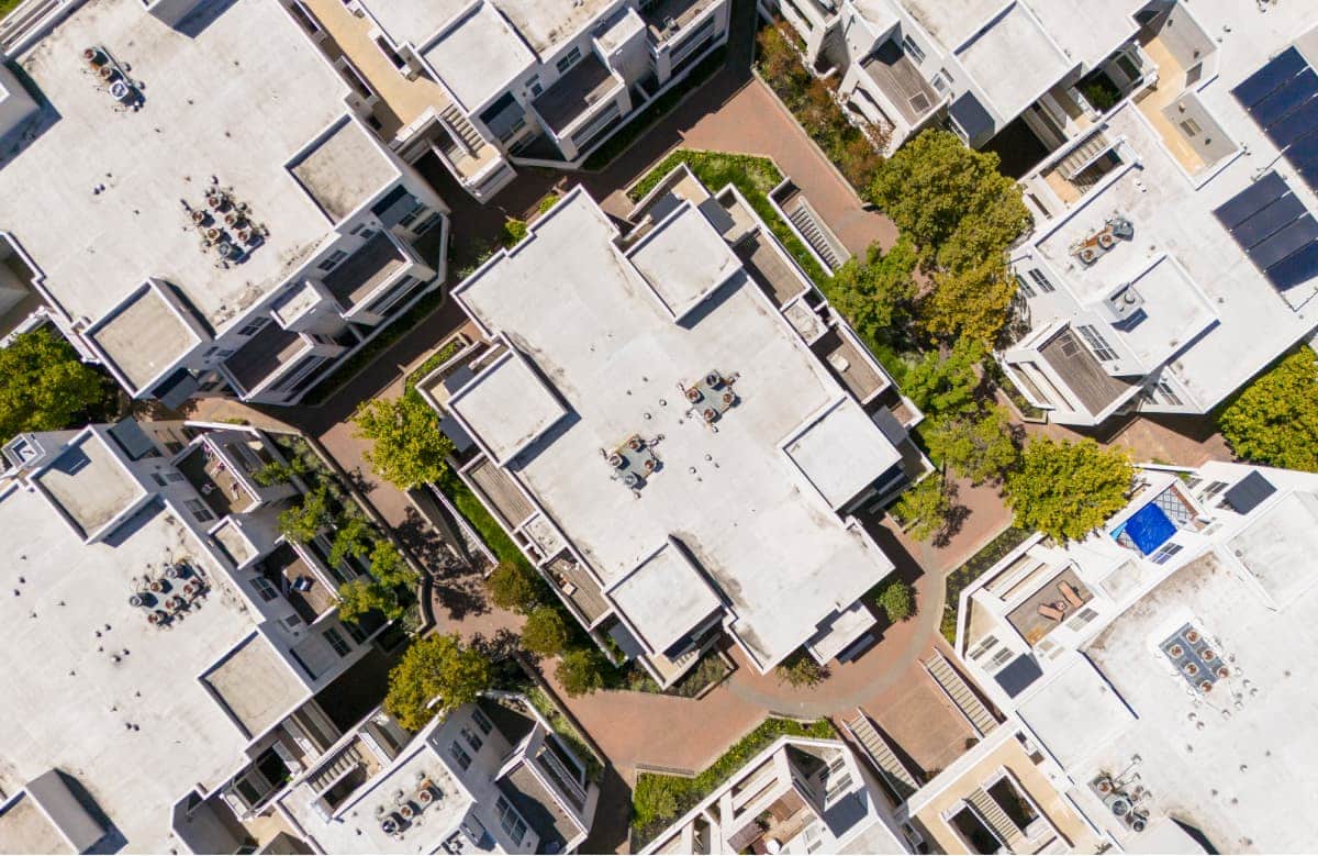 Aerial View Of Mixed Use Residential Complex With Courtyards And Landscaping