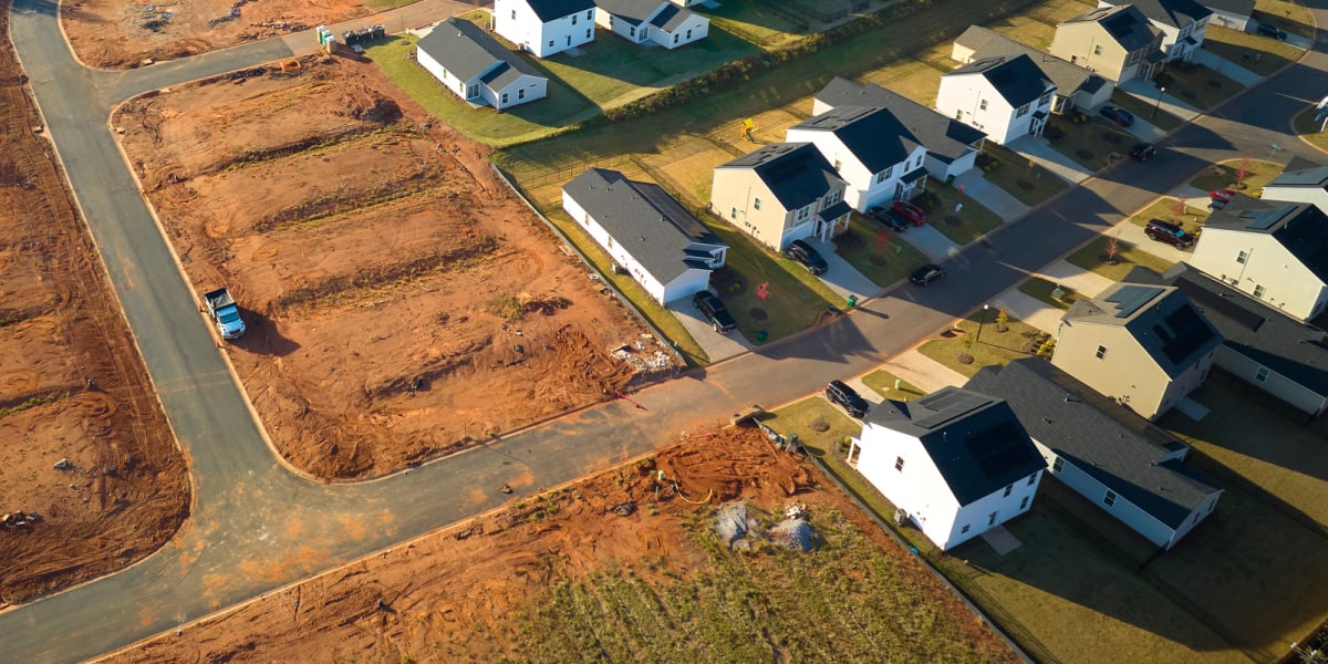 Aerial View Of Residential Neighborhood With New Home Construction On Vacant Lots