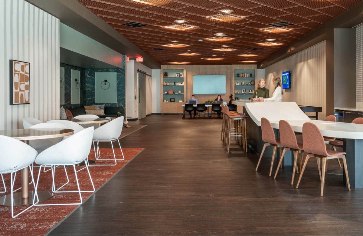 Modern Office Lobby With Wood Ceiling Reception Desk And People Working